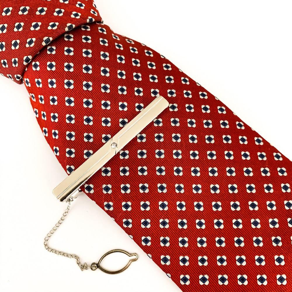 Stříbrná spona na kravatu s krystalem V.