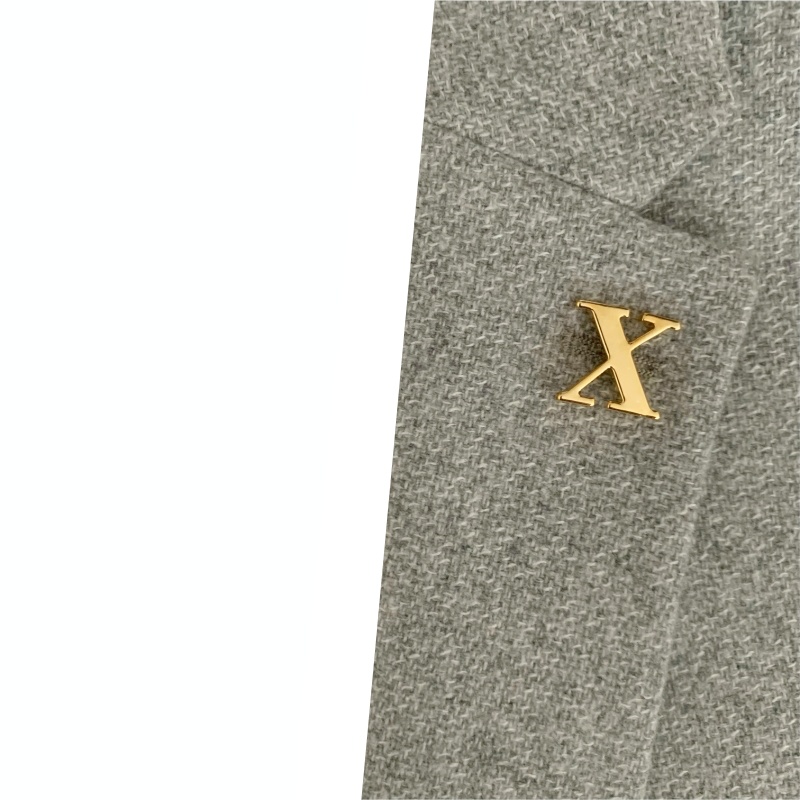 Zlatá brož písmeno X