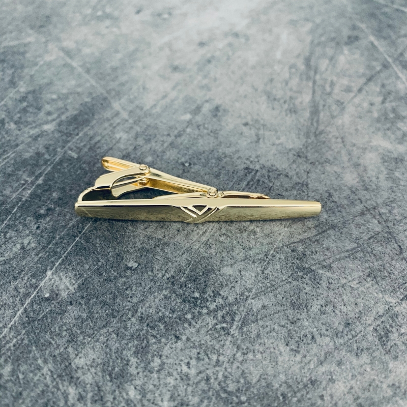 Zlatá spona na kravatu Ypsilon 