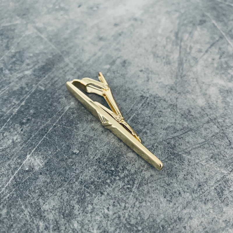 Zlatá spona na kravatu Ypsilon 